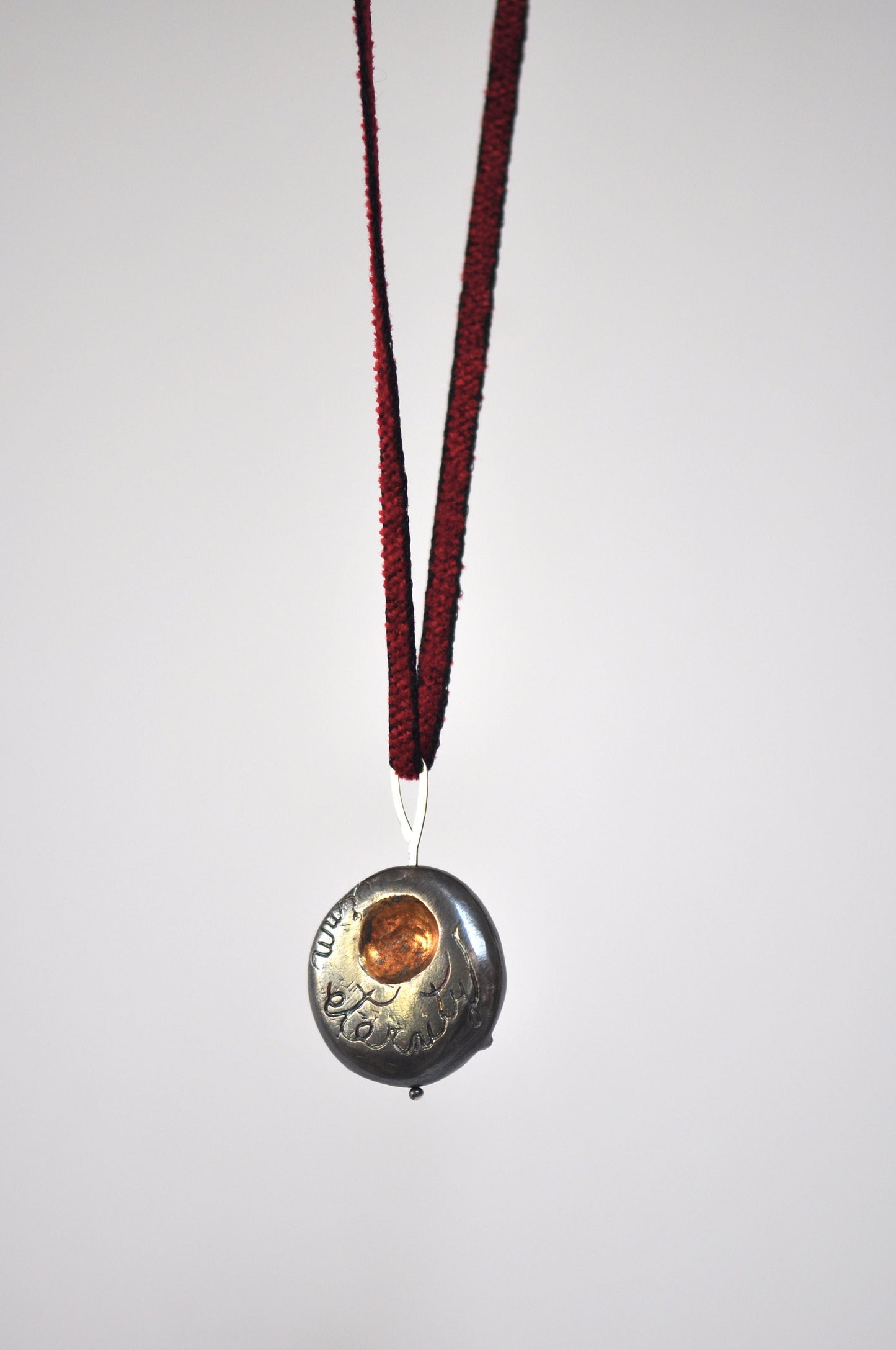 a necklace with a pendant with a picture on it