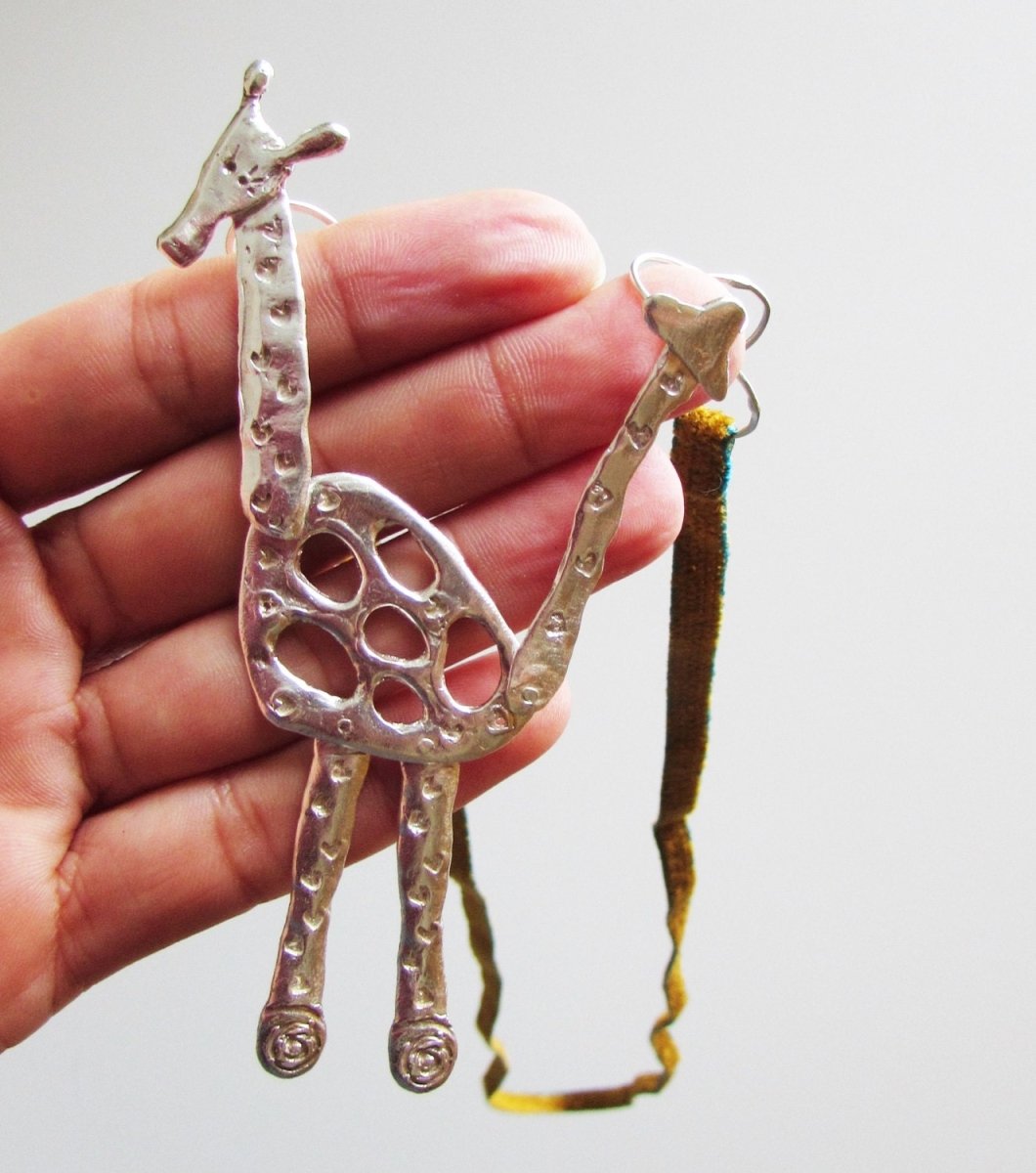 Handmade sterling silver articulated giraffe pendant necklace, whimsical animal jewelry, made in Barcelona
