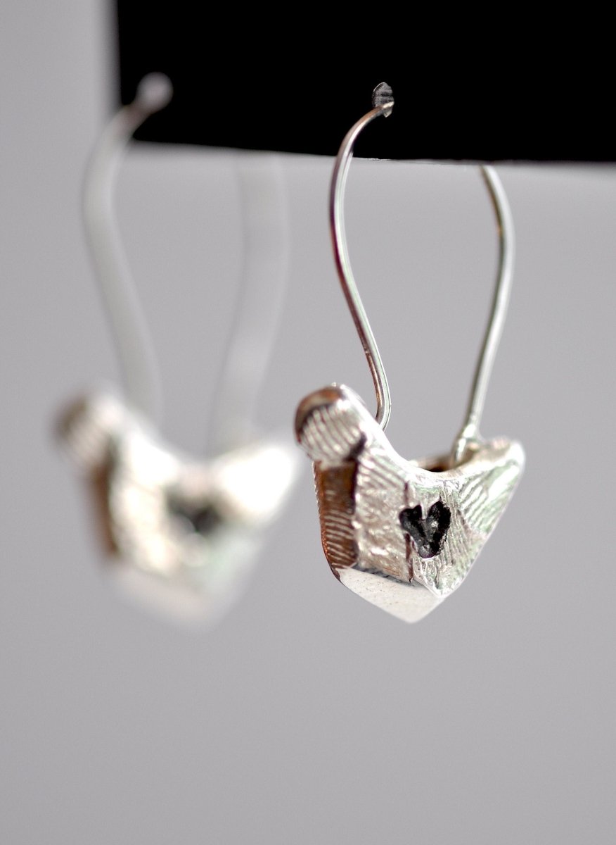 Handmade sterling silver bird charm earrings, whimsical nature jewelry, made in Barcelona