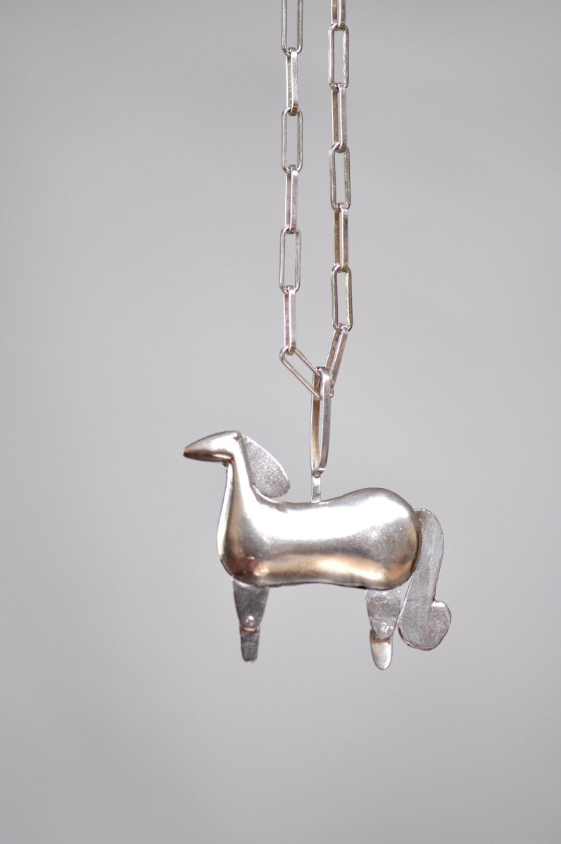 Handmade sterling silver articulated horse pendant necklace with sculptural body and articulated legs, made in Barcelona