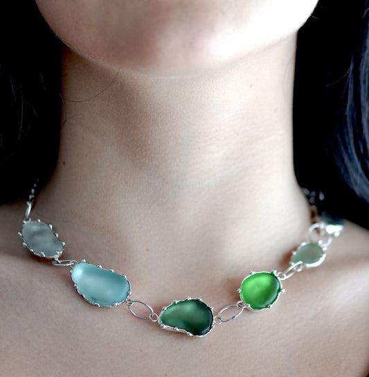Handmade sterling silver sea glass necklace with linked natural beach stones, made in Barcelona