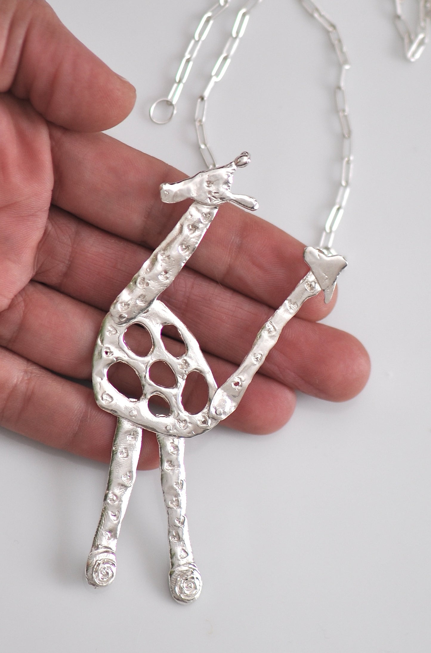 Handmade sterling silver articulated giraffe pendant necklace, whimsical animal jewelry