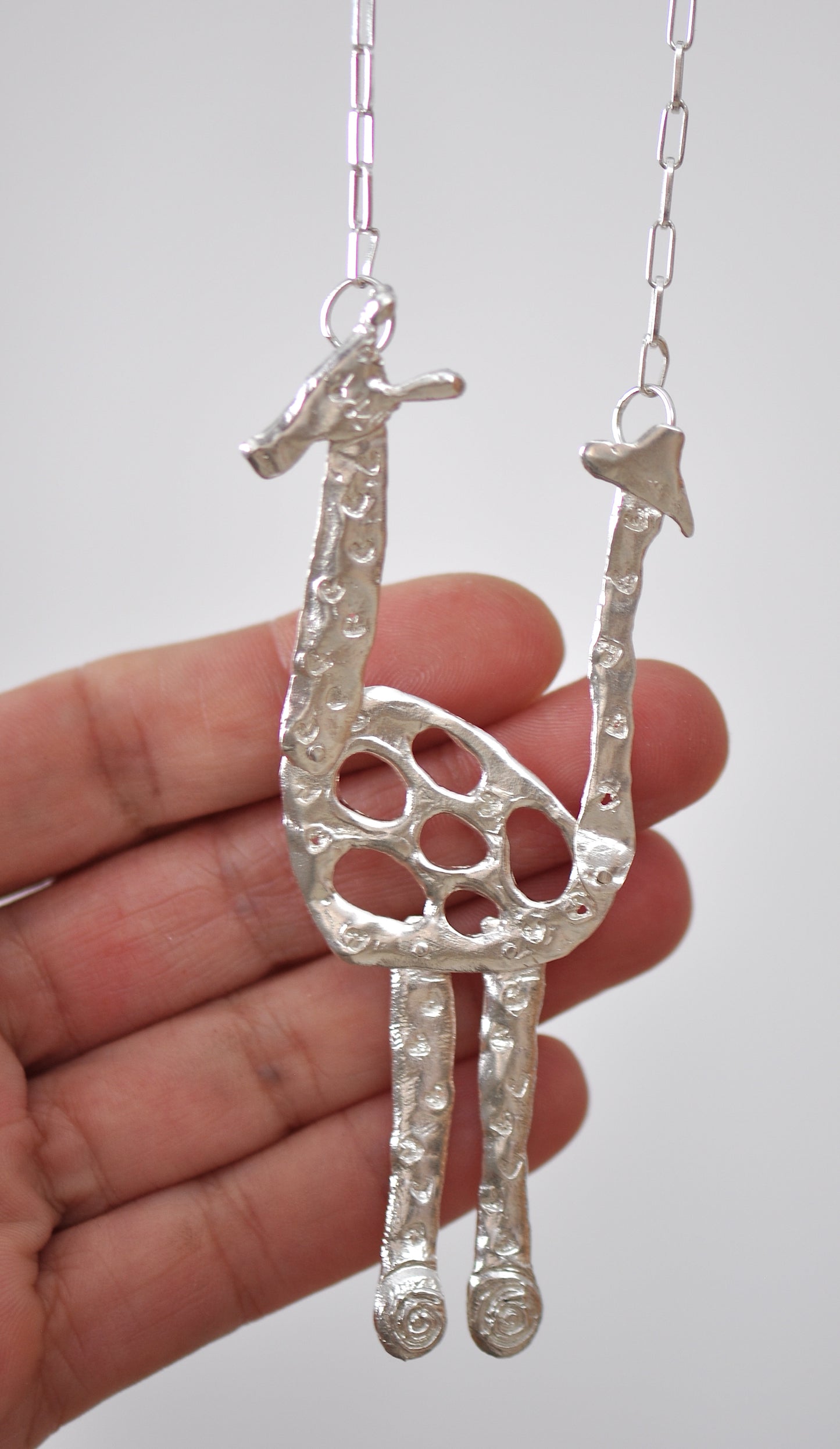 silver articulated giraffe pendant necklace