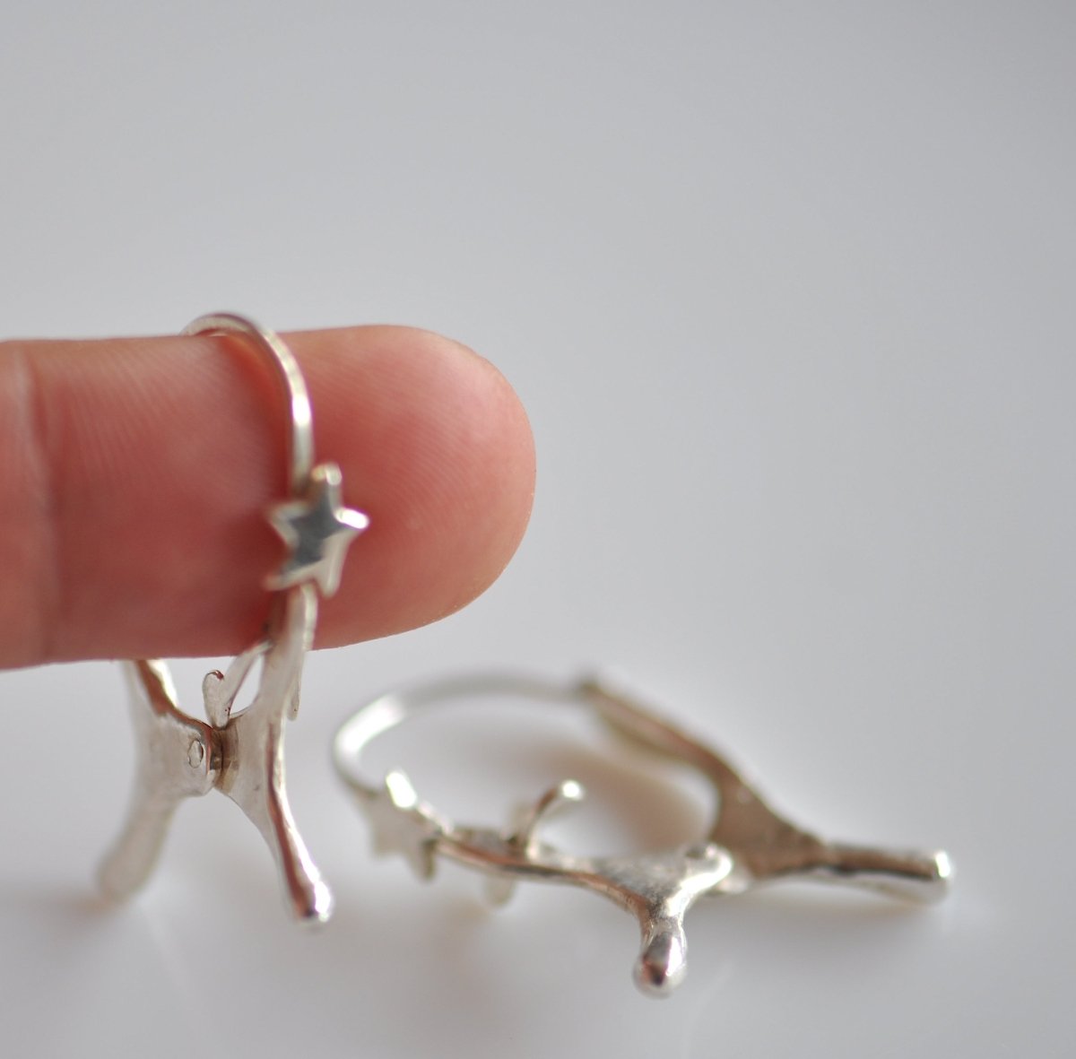 Handmade sterling silver dog shaped hoop earrings with articulated moving ears, made in Barcelona