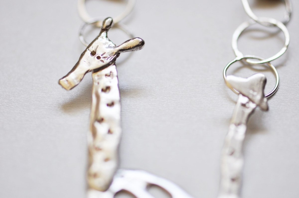 Handmade sterling silver articulated giraffe pendant necklace, whimsical animal jewelry, made in Barcelona