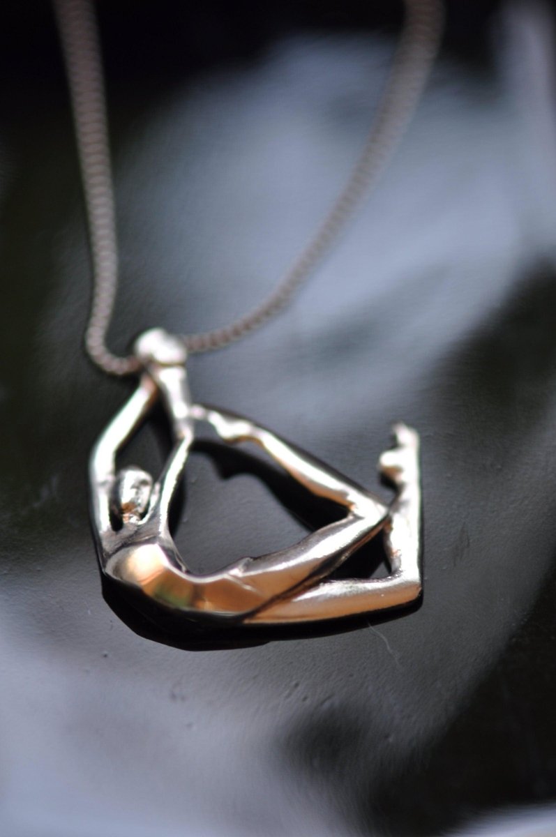 Handmade sterling silver swimmer pendant necklace with sculptural female figure in motion, wearable sculpture jewelry