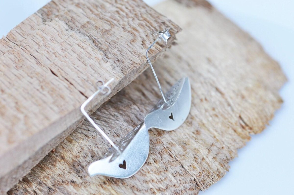 Dove Earrings | Handmade Sterling Silver Bird Dangle Earrings with Heart Detail - The Jewels You love