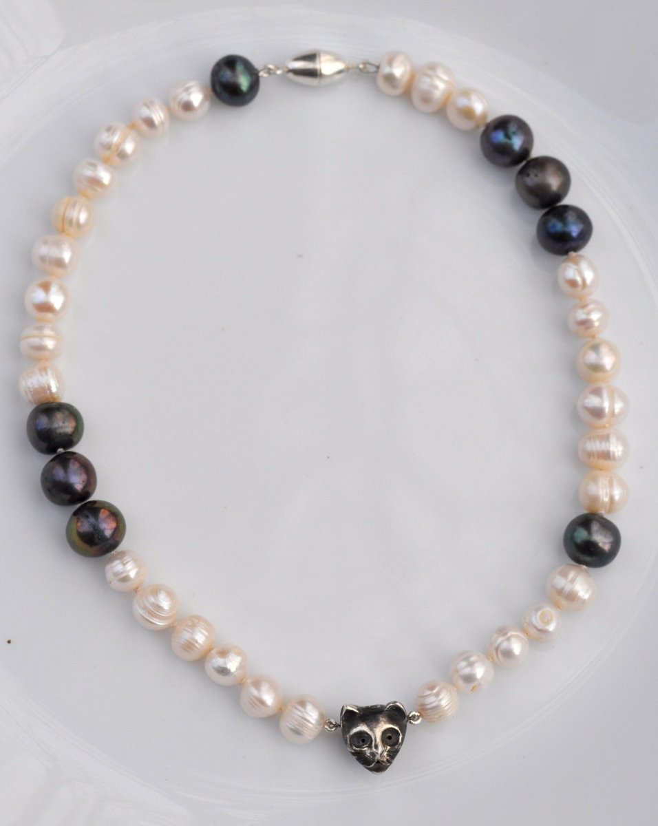 Handmade black and white freshwater pearl necklace with sterling silver cat charm and dark patina, unique cat jewelry