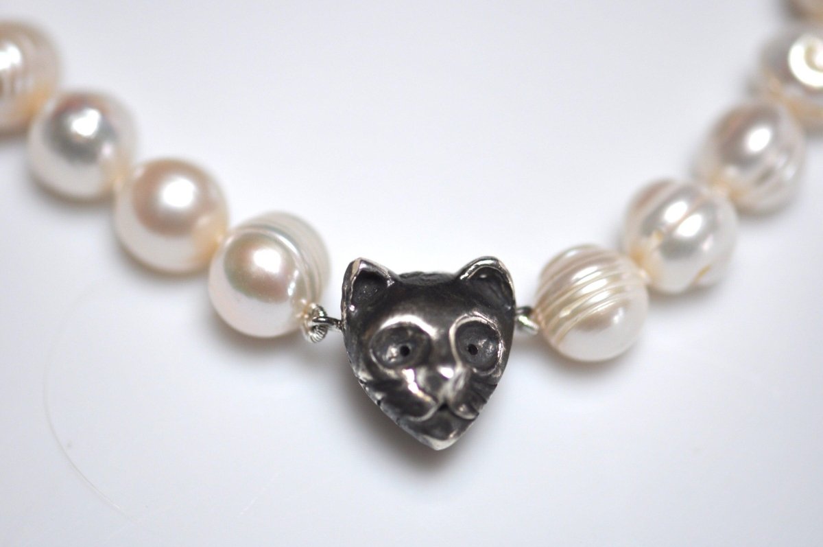 Handmade black and white freshwater pearl necklace with sterling silver cat charm and dark patina, unique cat jewelry