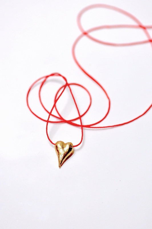 Handmade 14k gold plated sculptural heart charm necklace on adjustable red cord, unique gold heart jewelry