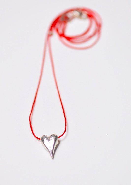 Handmade sterling silver heart drop charm necklace on adjustable red cord, unique heart jewelry