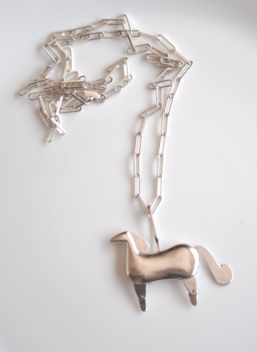 Handmade sterling silver articulated horse pendant necklace with sculptural body and articulated legs, made in Barcelona