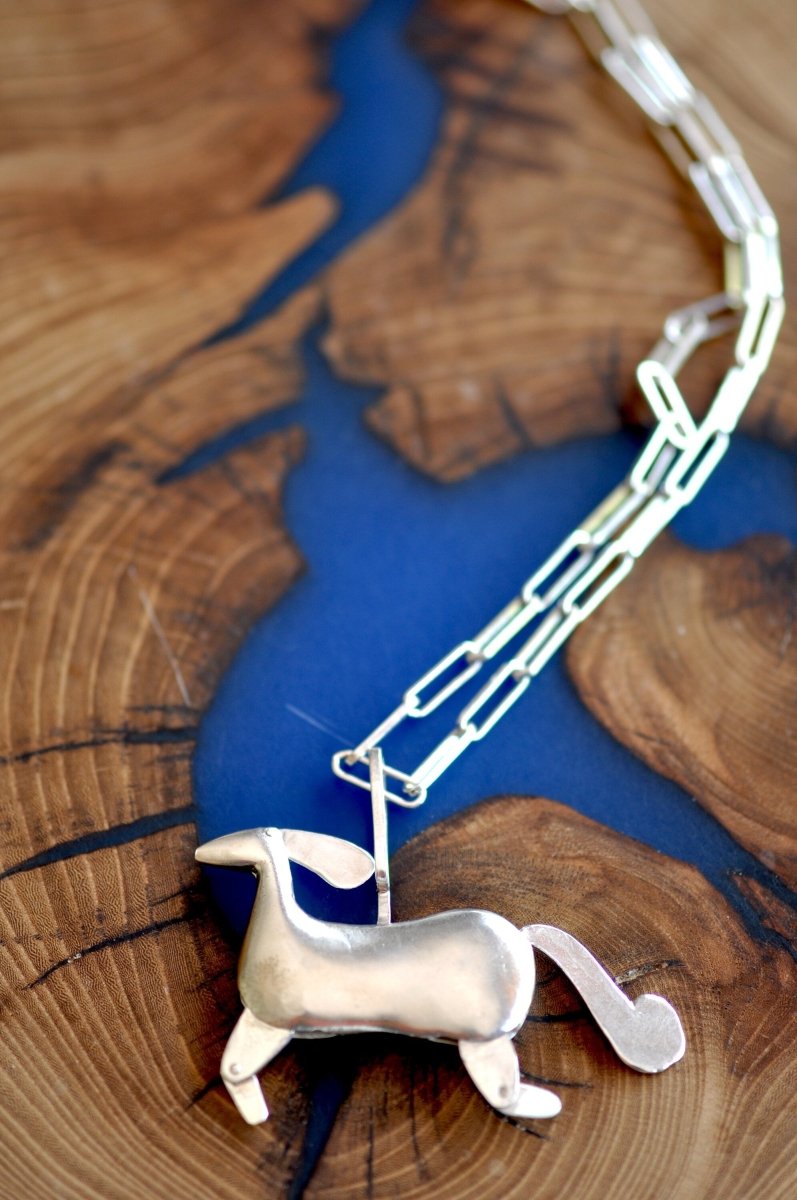 Handmade sterling silver articulated horse pendant necklace with sculptural body and articulated legs, made in Barcelona